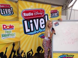 Look at @olivia_holt's drawing of a flower at #RDLive Fueled By @DoleFoods Fruit Squish'ems @ KidSpree in Denver, CO! 